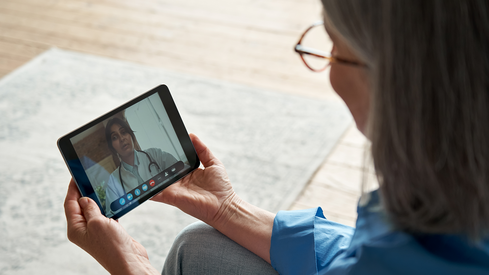 Two people talking via video chat on a handheld device.
